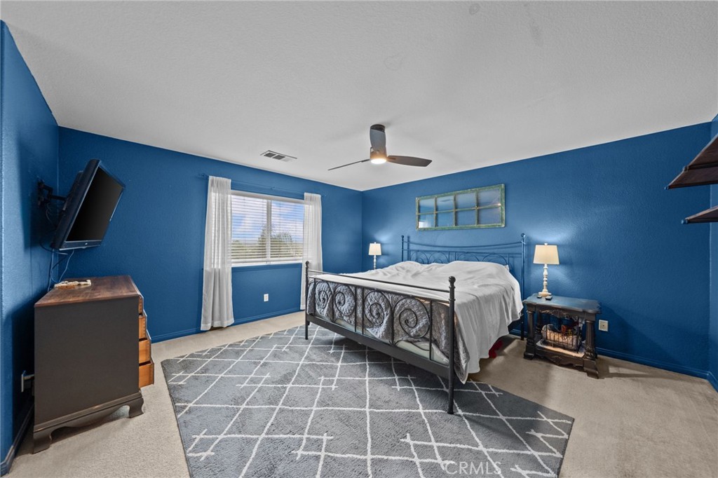 29266 Granite Ridge Court Menifee, CA 92587 - Photo 27 of 51 a bedroom with a bed and window