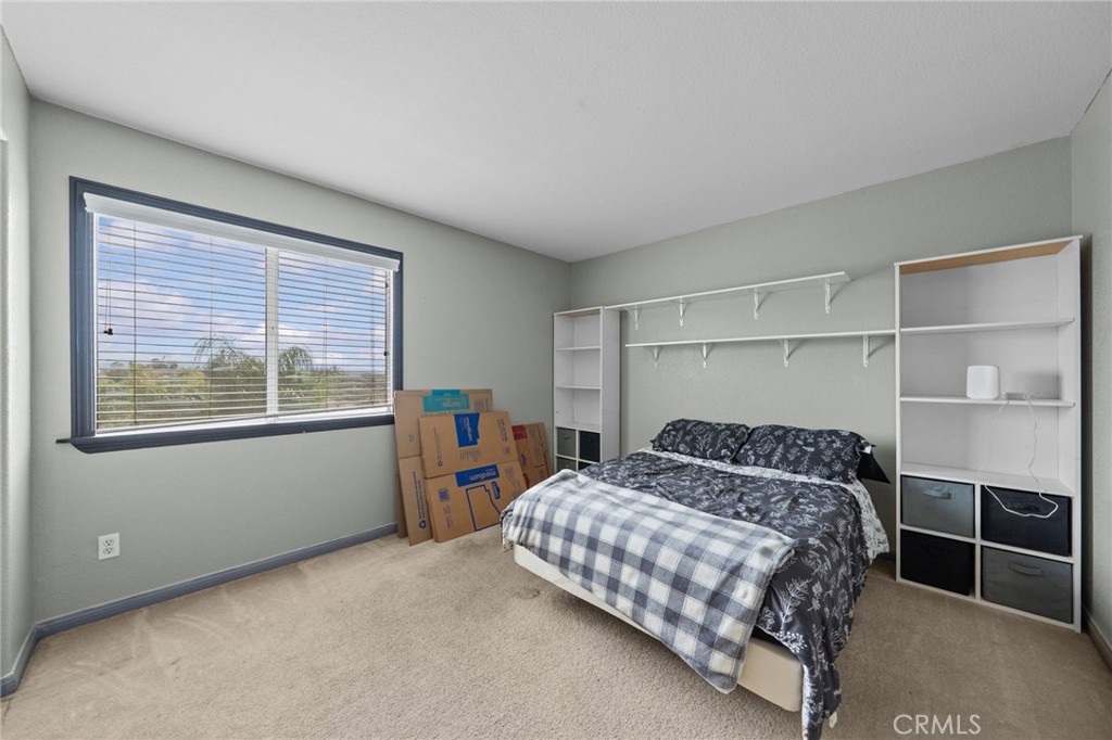 29266 Granite Ridge Court Menifee, CA 92587 - Photo 31 of 51 a bedroom with a bed and a window