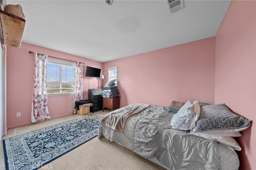 29266 Granite Ridge Court Menifee, CA 92587 - Photo 33 of 51 a bed sitting in a bedroom next to a window