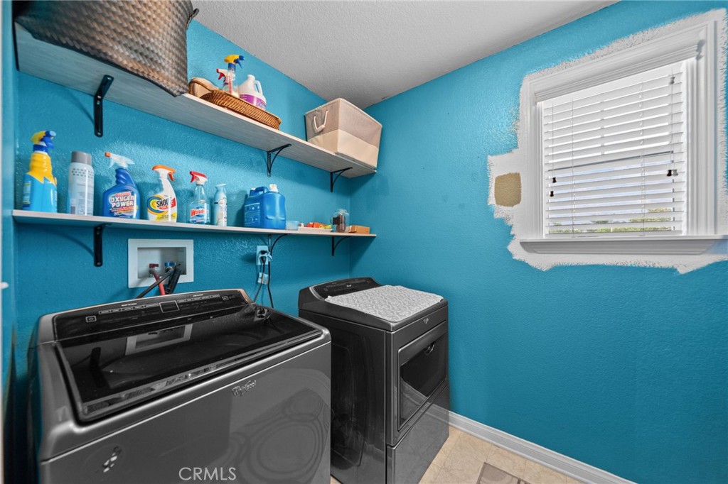 29266 Granite Ridge Court Menifee, CA 92587 - Photo 34 of 51 a utility room with dryer and washer