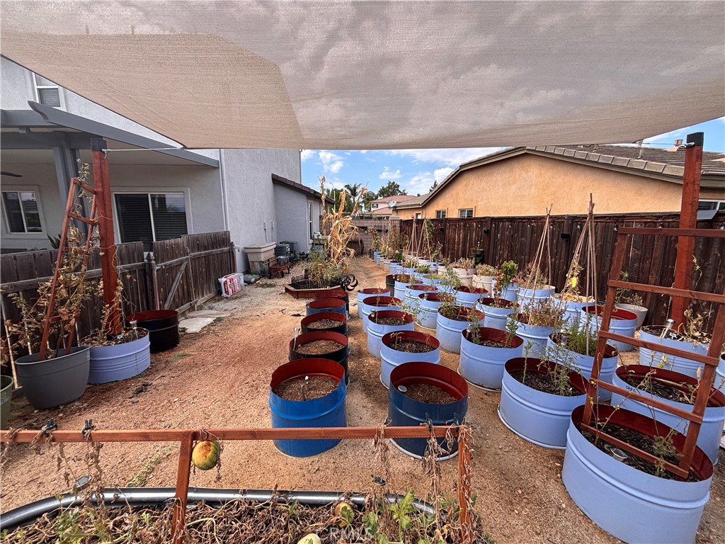 29266 Granite Ridge Court Menifee, CA 92587 - Photo 42 of 51 a living room with lots of furniture and a fireplace