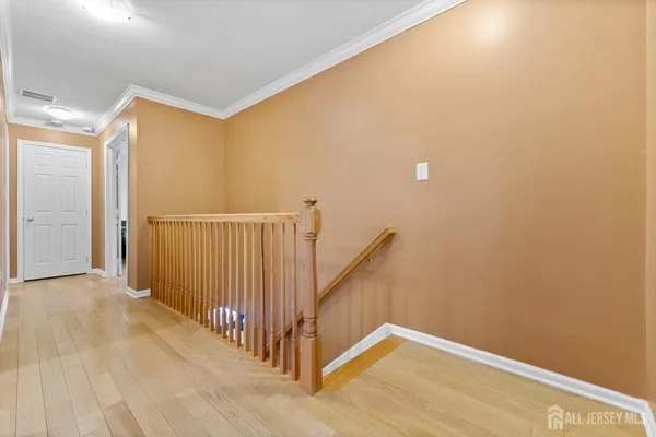 a bedroom with a bed and a television