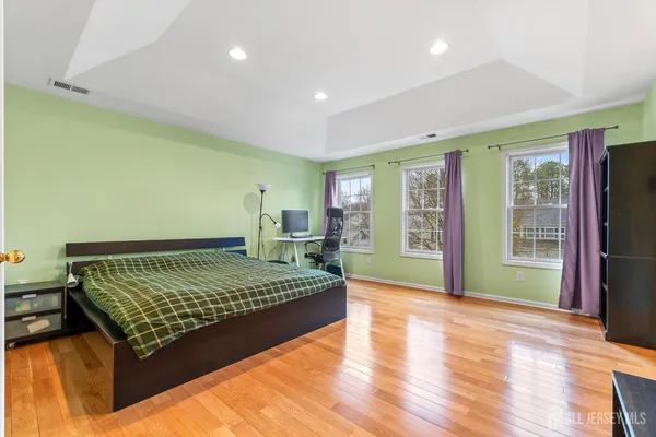 a bed room with a bed and a window