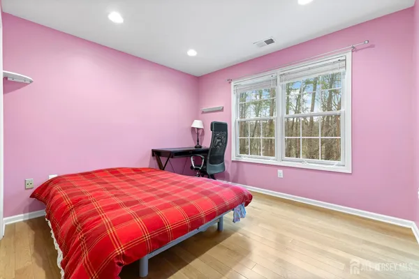 a bathroom with a sink a toilet a mirror and vanity