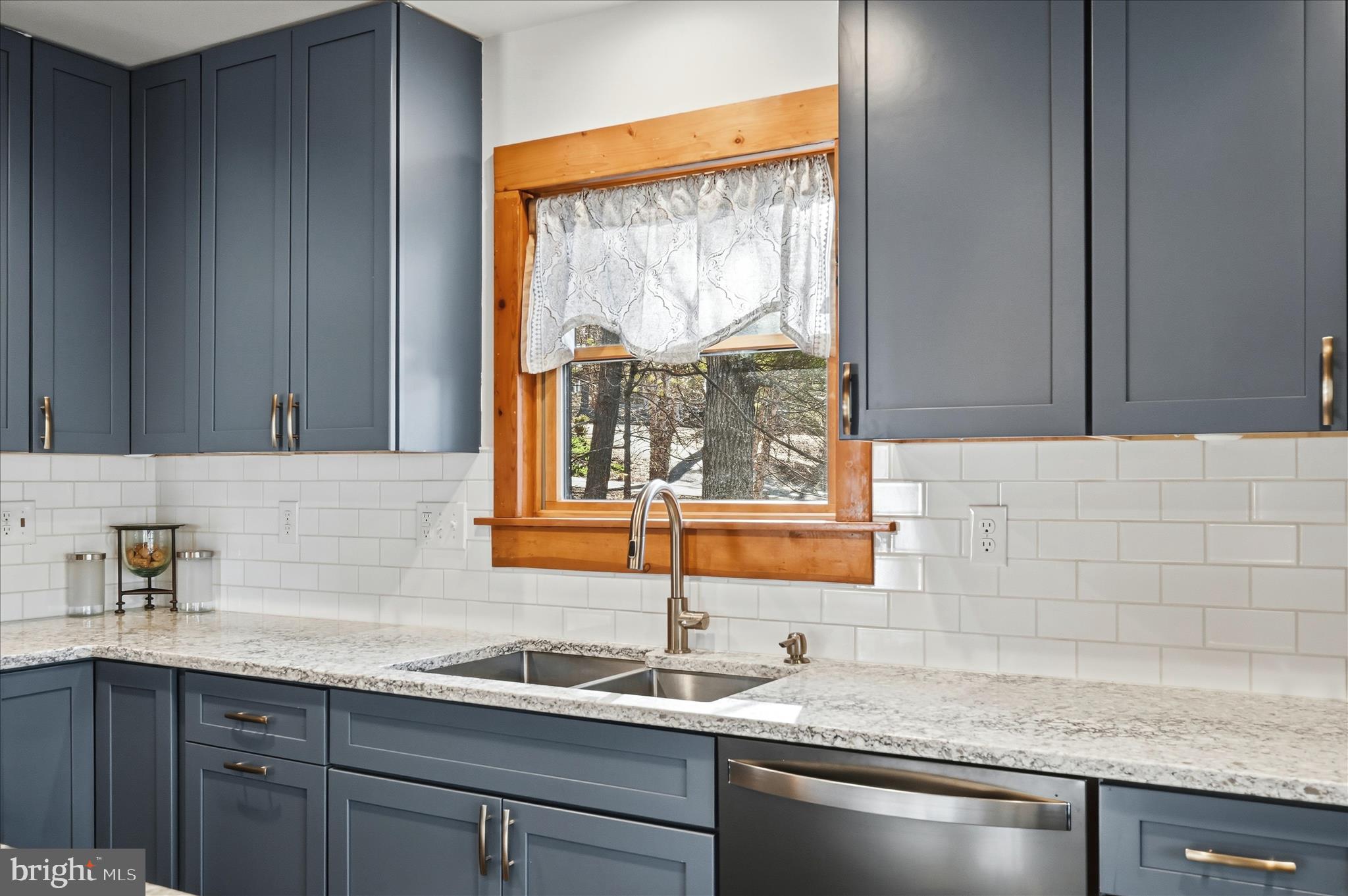 241 Sunset Circle Cross Junction, VA 22625 - Photo 26 of 98 Sleek subway tile backsplash & upgraded counters