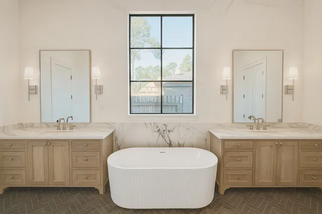 a living room with furniture a flat screen tv and a window