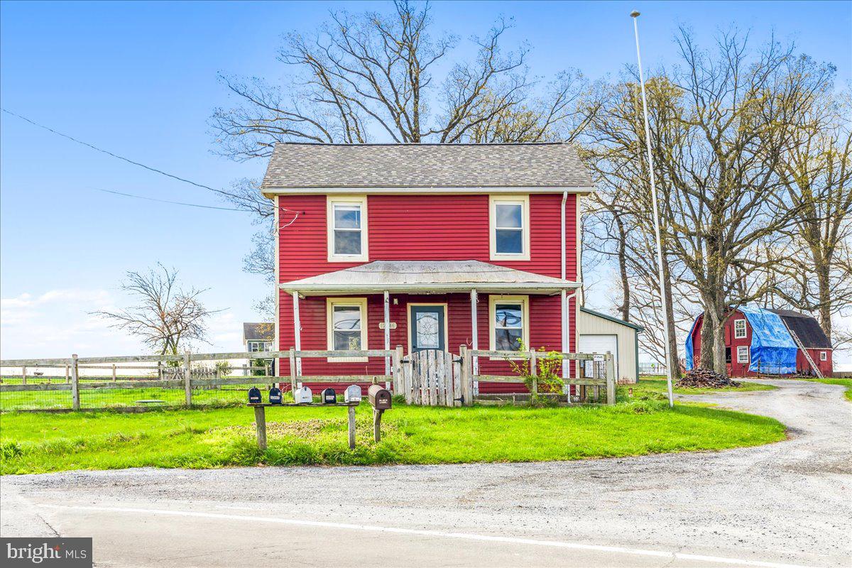 12446 Renner Road Keymar, MD 21757 - Photo 1 of 40 a view of a house with a yard and plants