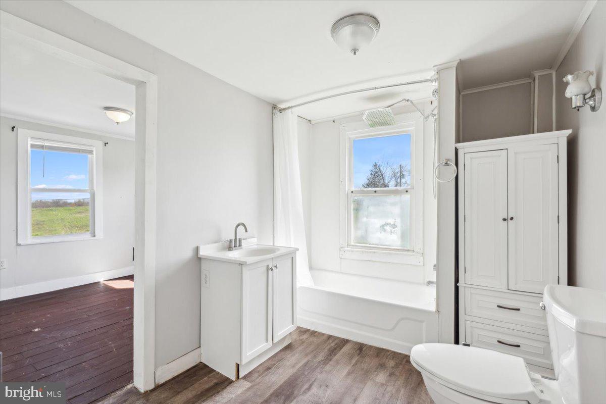 12446 Renner Road Keymar, MD 21757 - Photo 24 of 40 a bathroom with a sink a toilet and tub