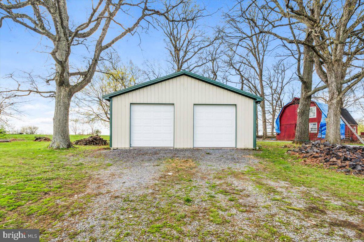 12446 Renner Road Keymar, MD 21757 - Photo 37 of 40 a view of a house with a yard and garage