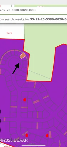 a view of a red wall with a book shelf