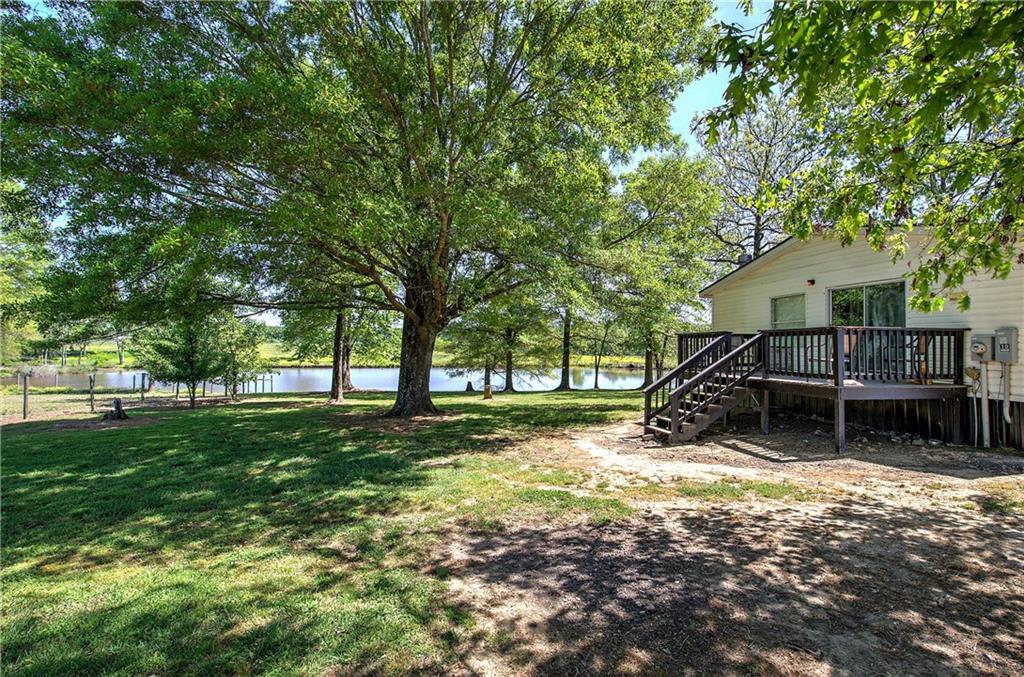 486 County Line Road Resaca, GA 30735 - Photo 3 of 33 a view of a house with backyard and a tree