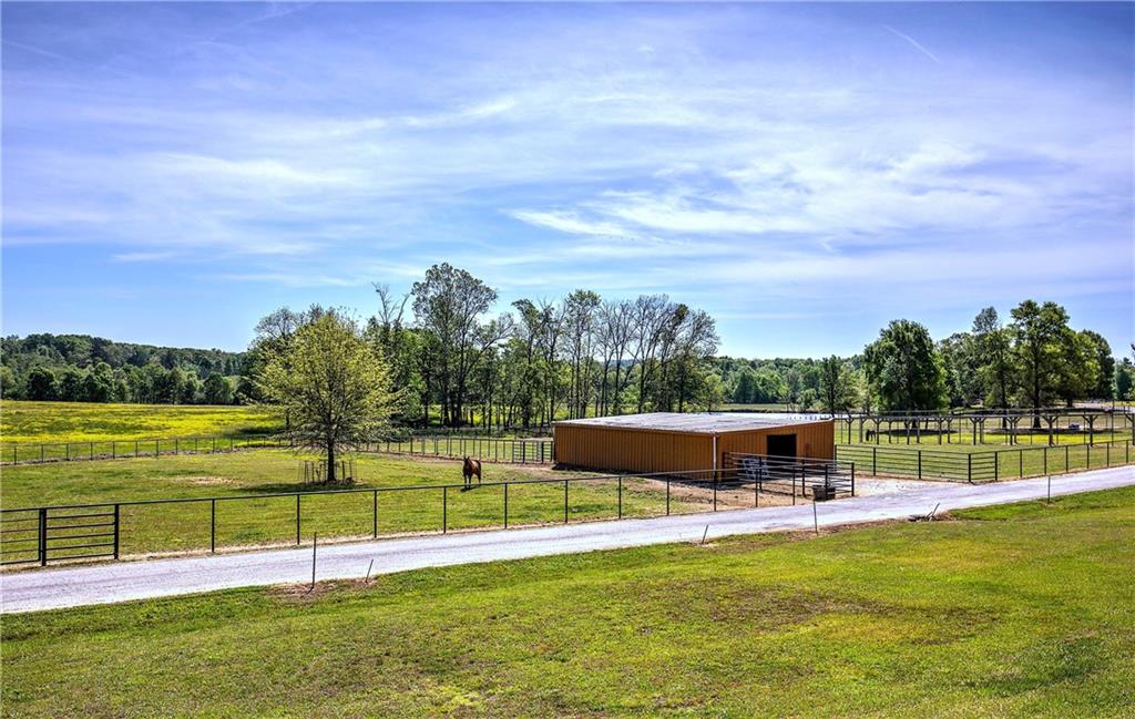 486 County Line Road Resaca, GA 30735 - Photo 10 of 33 a view of a swimming pool with a garden and lake view