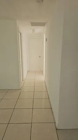 a view of hallway with a window