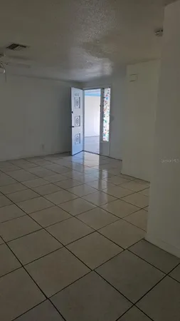 a view of an empty room and window