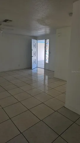 a view of an empty room and window