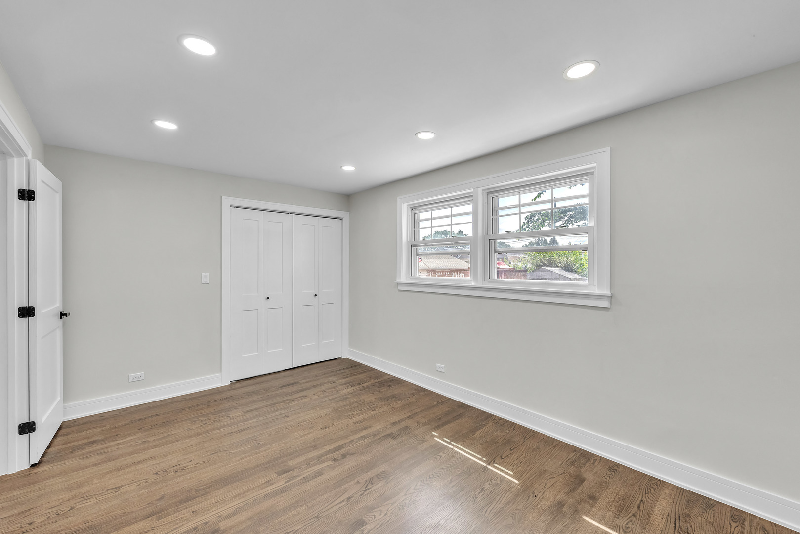 5331 West 53rd Place Chicago, IL 60638 - Photo 13 of 28 a view of empty room with wooden floor and fan