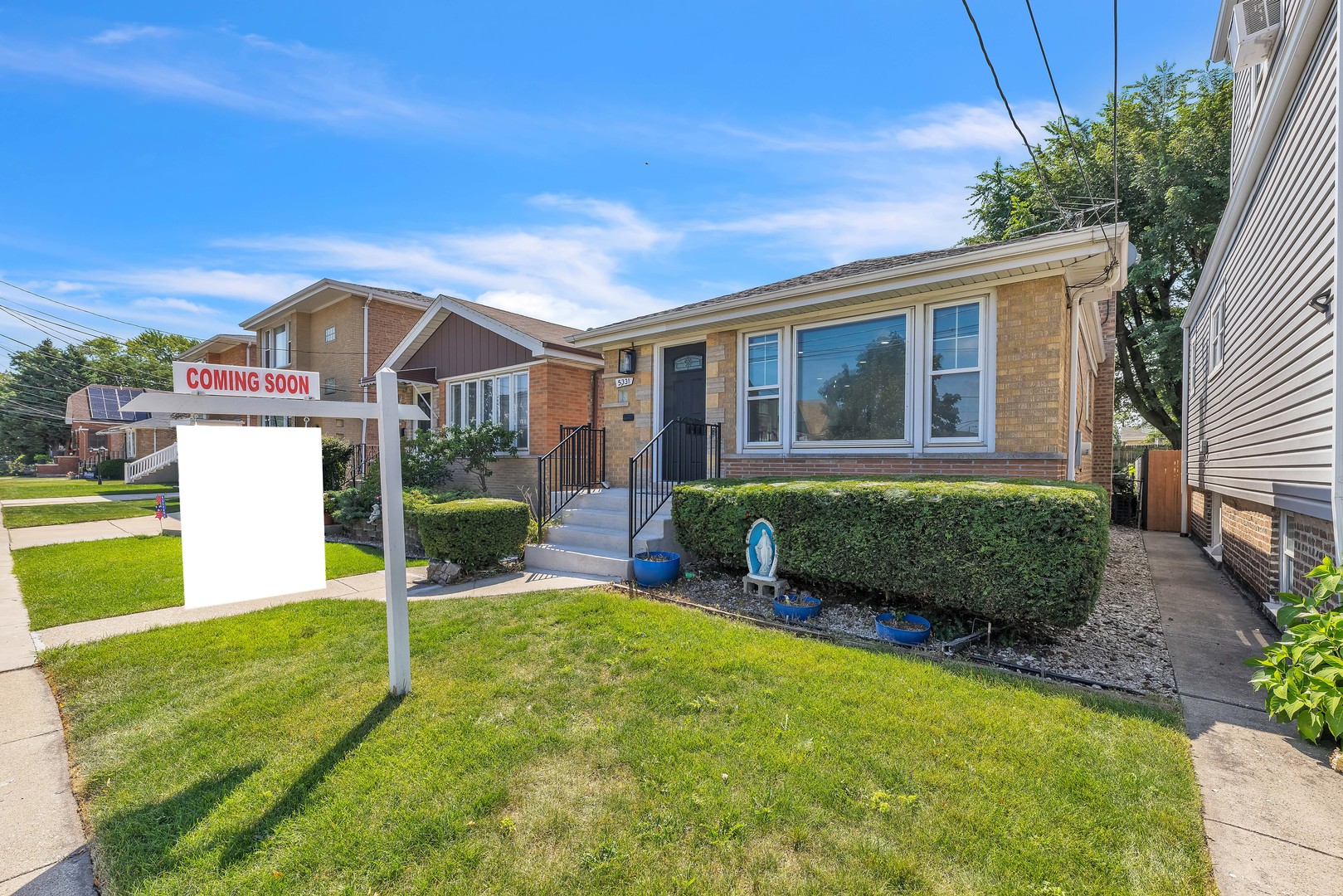 5331 West 53rd Place Chicago, IL 60638 - Photo 2 of 28 a view of a house with a big yard potted plants and large tree