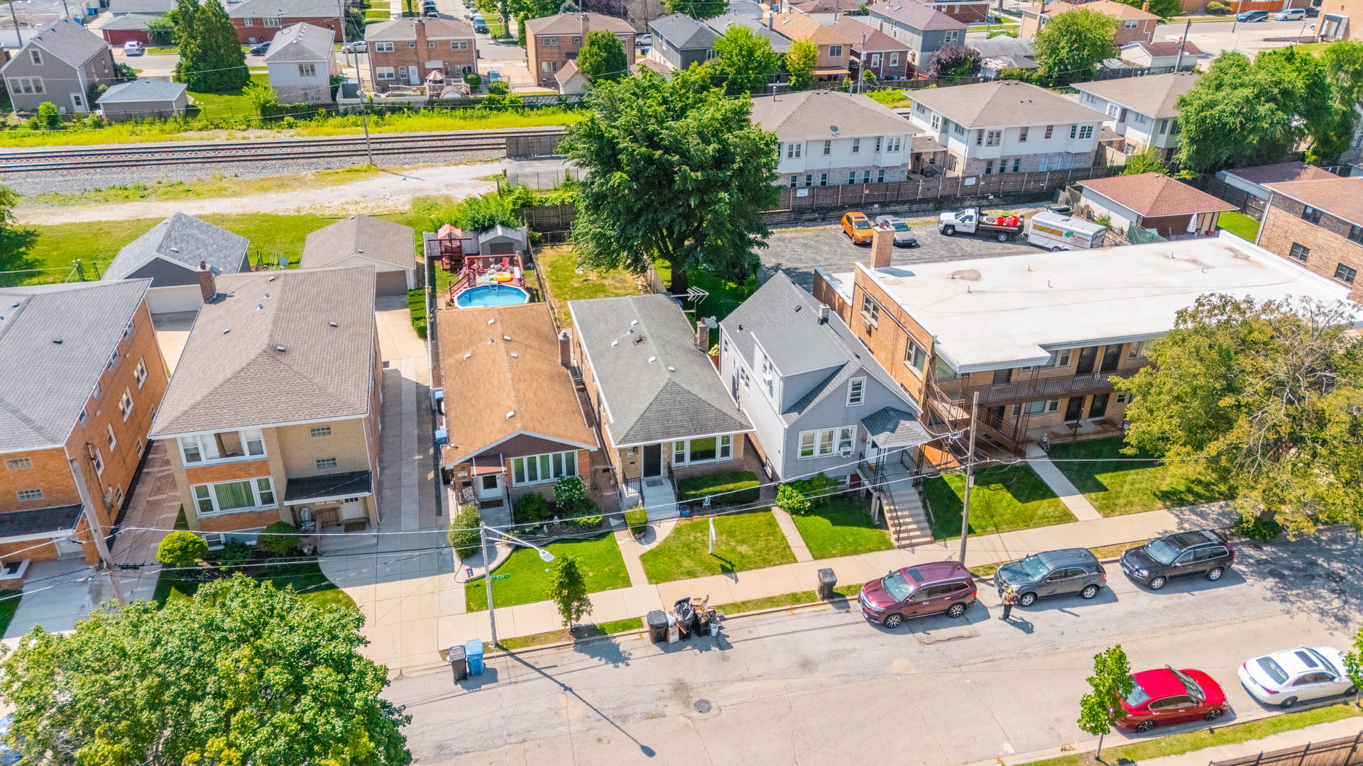 5331 West 53rd Place Chicago, IL 60638 - Photo 24 of 28 an aerial view of residential houses with swimming pool and outdoor space