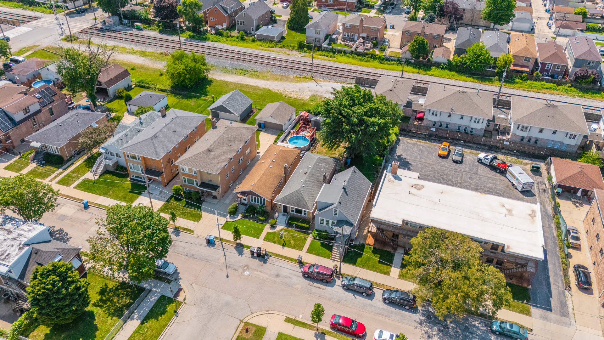 5331 West 53rd Place Chicago, IL 60638 - Photo 25 of 28 an aerial view of a house with a garden and swimming pool