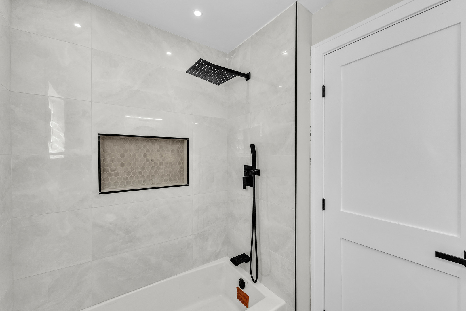 5331 West 53rd Place Chicago, IL 60638 - Photo 9 of 28 a bathroom with a shower and a tub