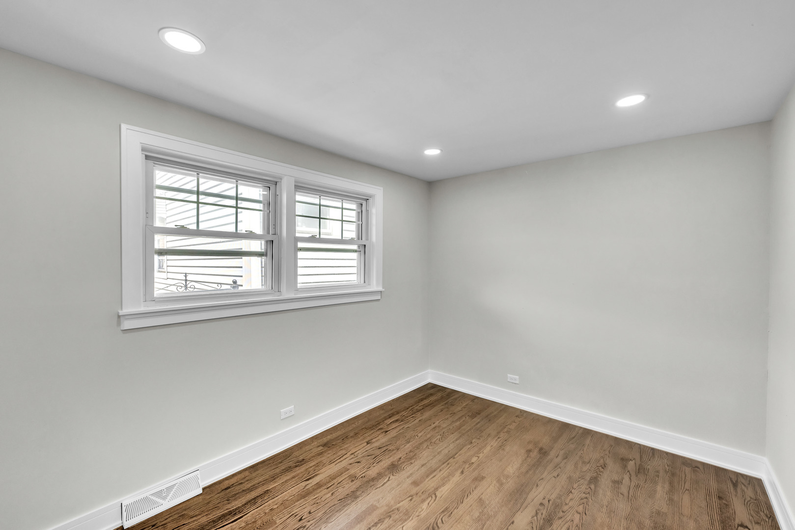 5331 West 53rd Place Chicago, IL 60638 - Photo 10 of 28 an empty room with wooden floor and windows