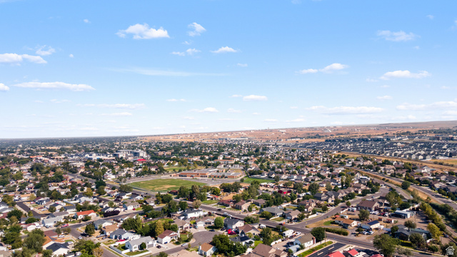 3396 Carmy Road Magna, UT 84044 - Photo 32 of 32 Expansive aerial showcasing a residential neighborhood with varied housing styles