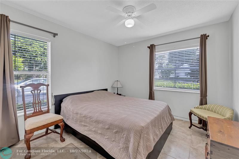 7359 Pine Park Drive North Lake Worth, FL 33467 - Photo 14 of 47 a bedroom with a bed and a window