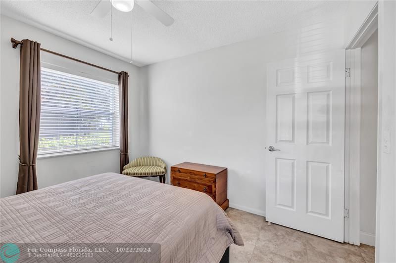 7359 Pine Park Drive North Lake Worth, FL 33467 - Photo 15 of 47 a bedroom with a bed and a window