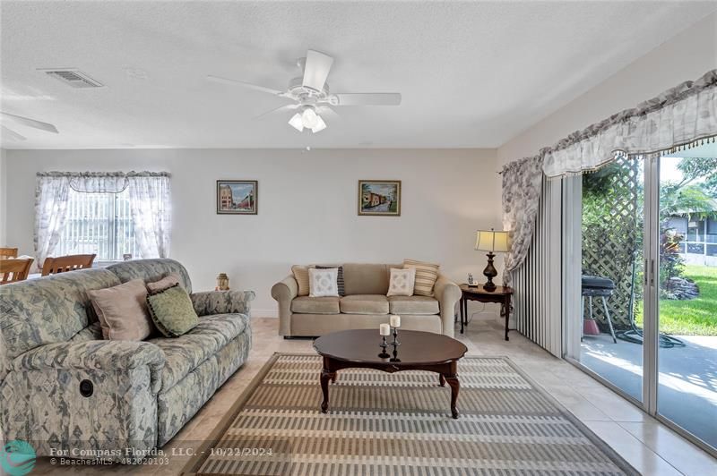 7359 Pine Park Drive North Lake Worth, FL 33467 - Photo 24 of 47 a living room with furniture and a rug