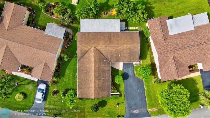 7359 Pine Park Drive North Lake Worth, FL 33467 - Photo 3 of 47 an aerial view of a house with garden space and a street view