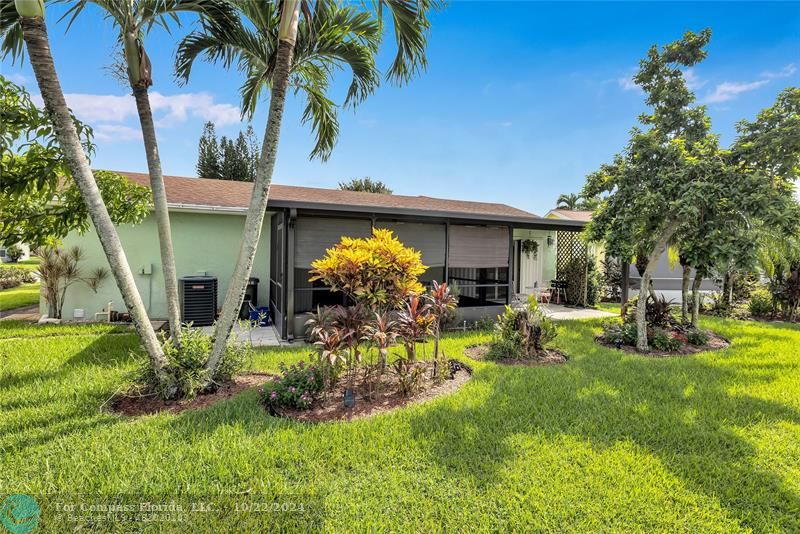 7359 Pine Park Drive North Lake Worth, FL 33467 - Photo 36 of 47 front view of a house with a yard