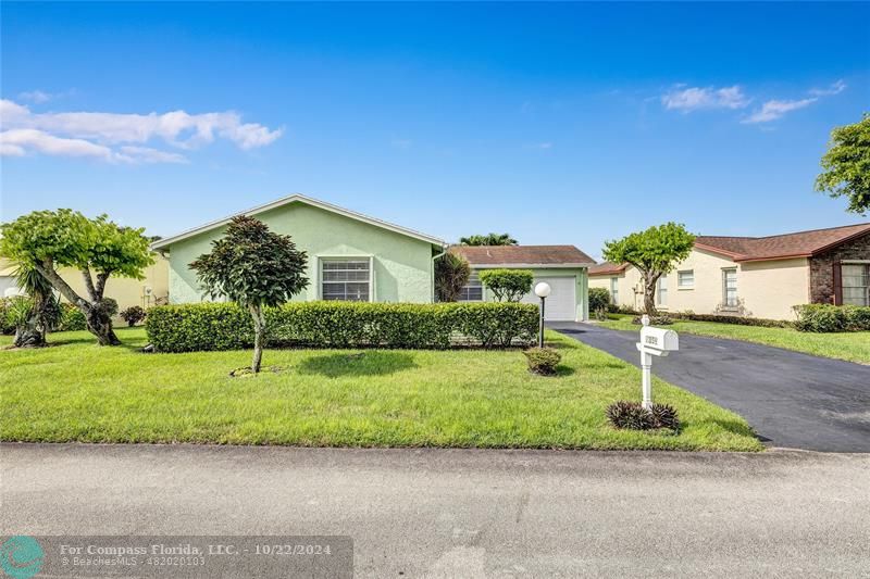 7359 Pine Park Drive North Lake Worth, FL 33467 - Photo 38 of 47 a house that has a tree in front of it