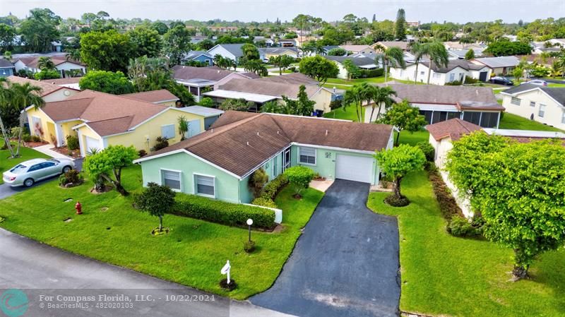 7359 Pine Park Drive North Lake Worth, FL 33467 - Photo 41 of 47 an aerial view of multiple houses with a yard
