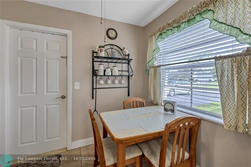 7359 Pine Park Drive North Lake Worth, FL 33467 - Photo 5 of 47 a view of a dining room with furniture window and outside view