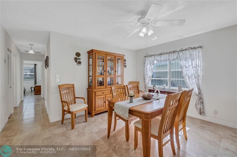 7359 Pine Park Drive North Lake Worth, FL 33467 - Photo 6 of 47 a dining room with furniture and window