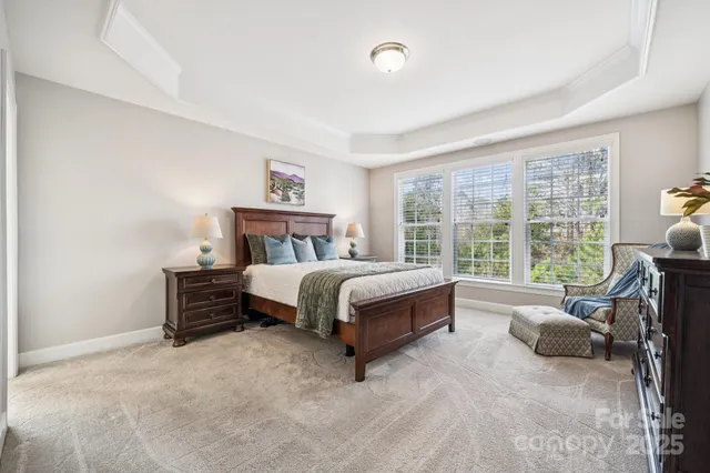 a bed room with a bed and a chair