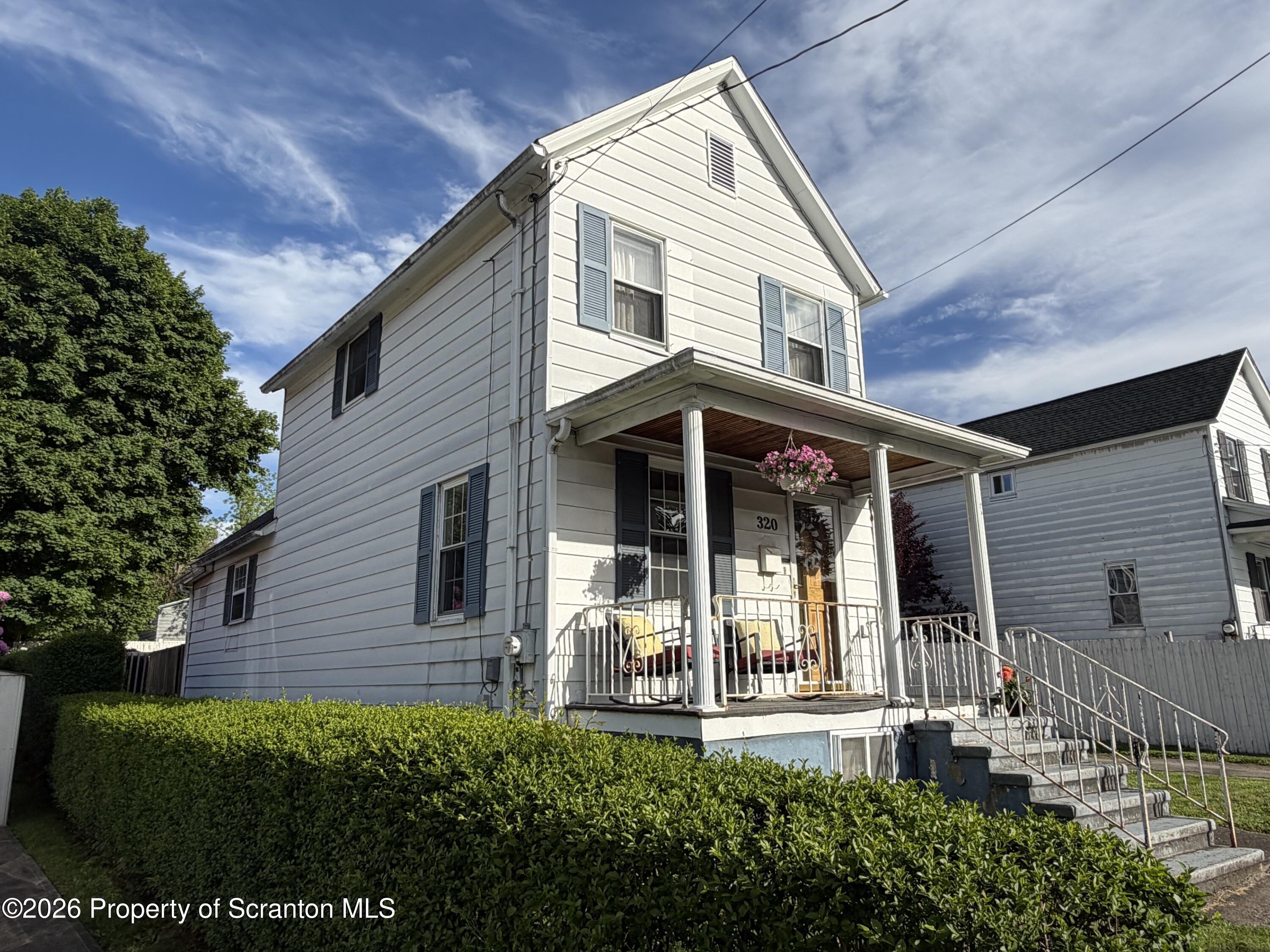 320 Haverly Street Throop, PA 18512 - Photo 2 of 27 front view of a house with a yard