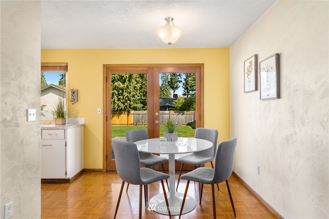 4612 Northeast 23rd Street Renton, WA 98059 - Photo 11 of 24 a view of a dining room with furniture and a window