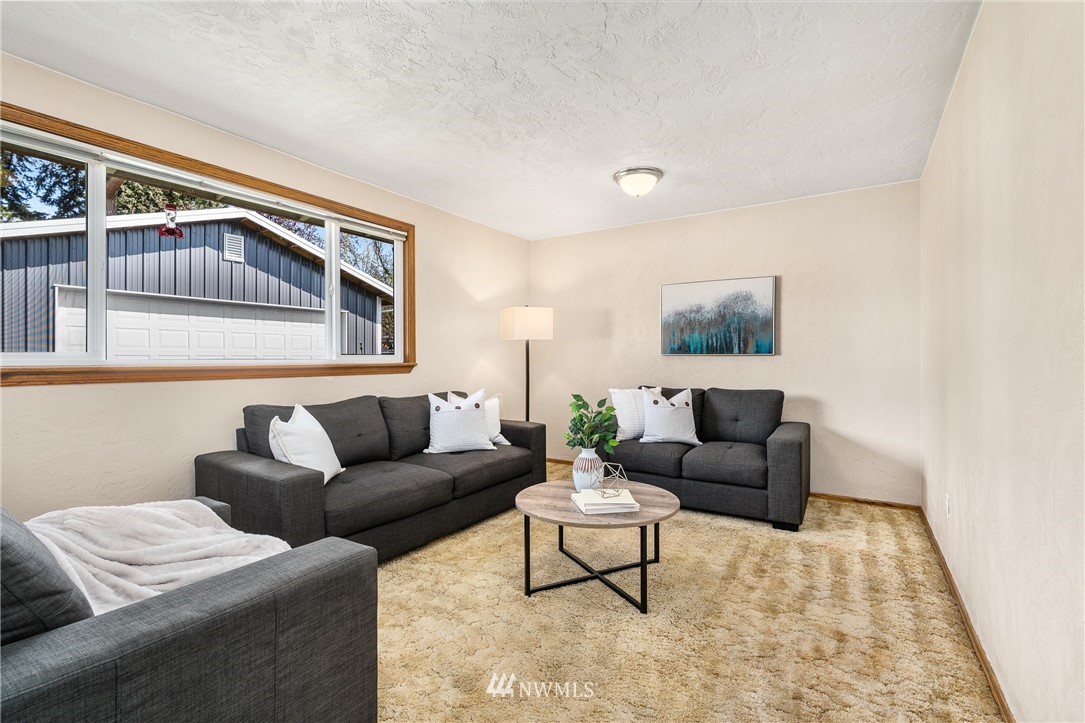 4612 Northeast 23rd Street Renton, WA 98059 - Photo 14 of 24 a living room with furniture and a window