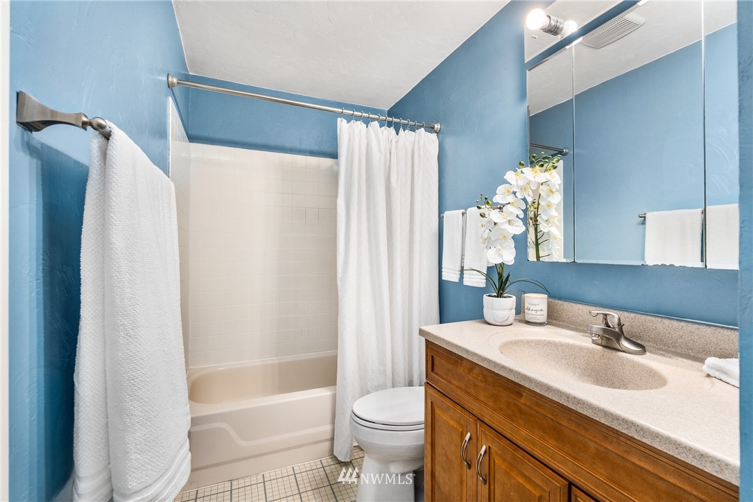 4612 Northeast 23rd Street Renton, WA 98059 - Photo 17 of 24 a bathroom with a sink toilet and shower