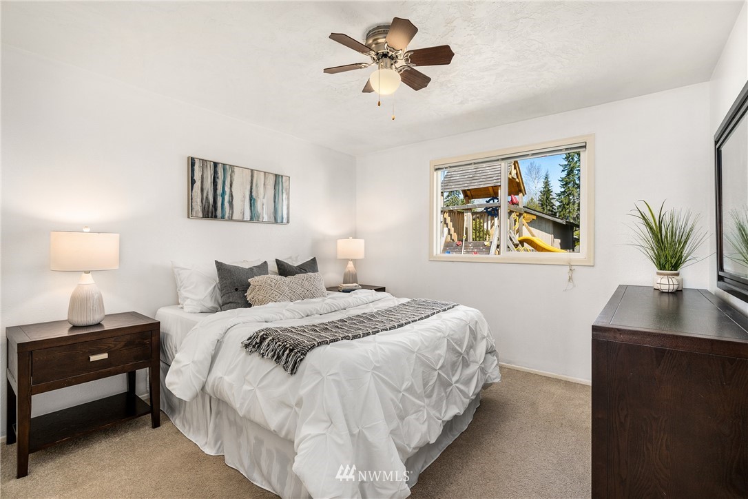 4612 Northeast 23rd Street Renton, WA 98059 - Photo 19 of 24 a bedroom with a bed and a desk