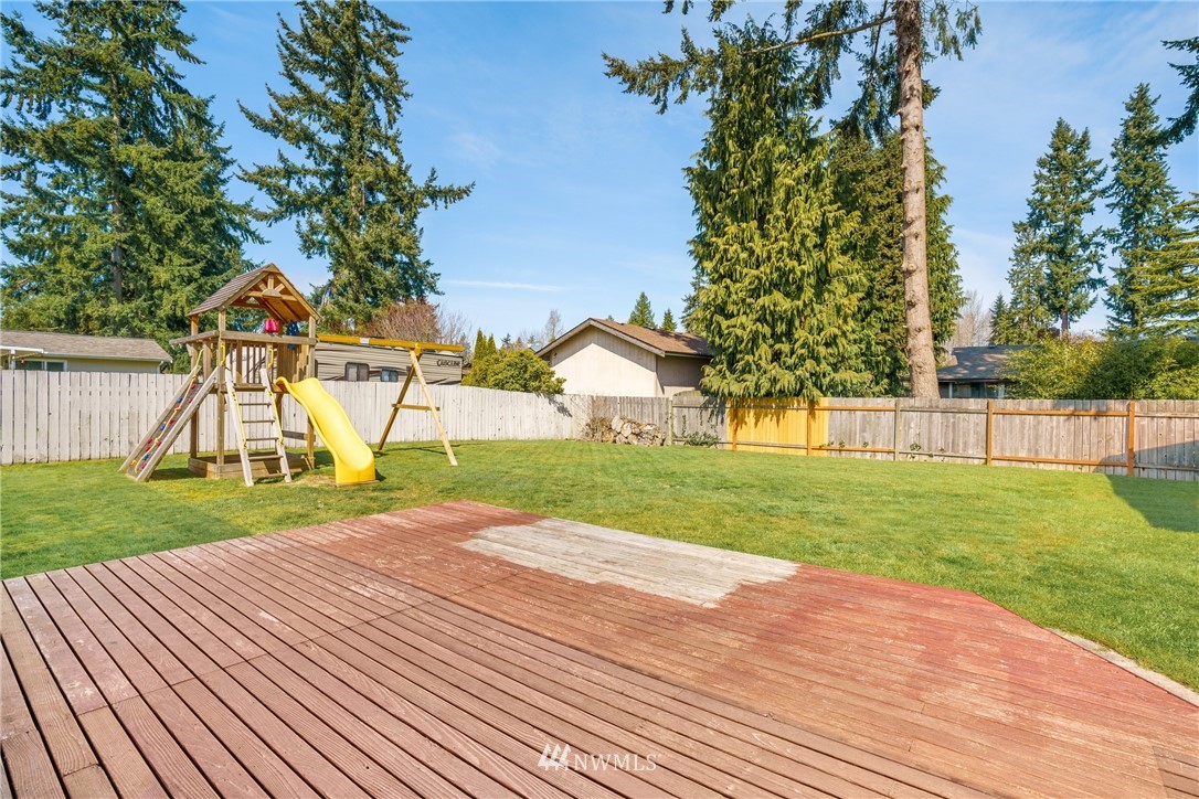 4612 Northeast 23rd Street Renton, WA 98059 - Photo 20 of 24 a view of a house with a yard