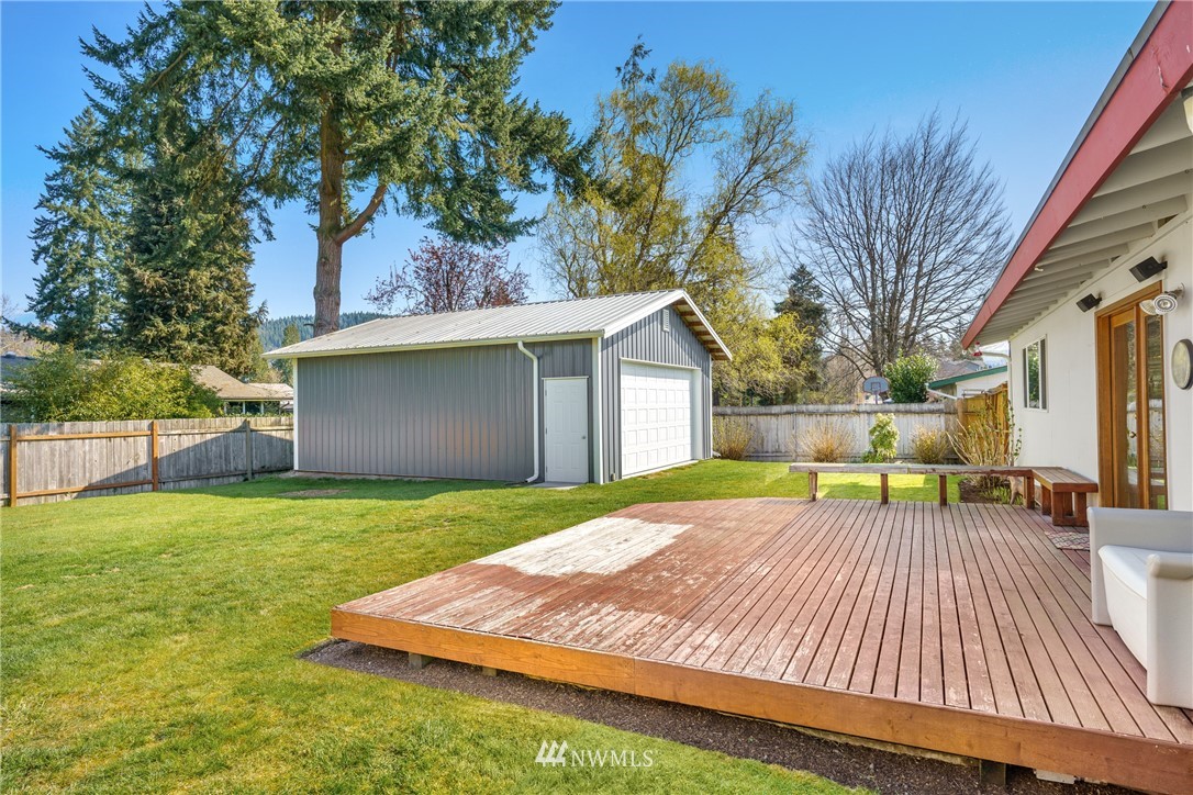 4612 Northeast 23rd Street Renton, WA 98059 - Photo 21 of 24 a view of a house with backyard and a tree