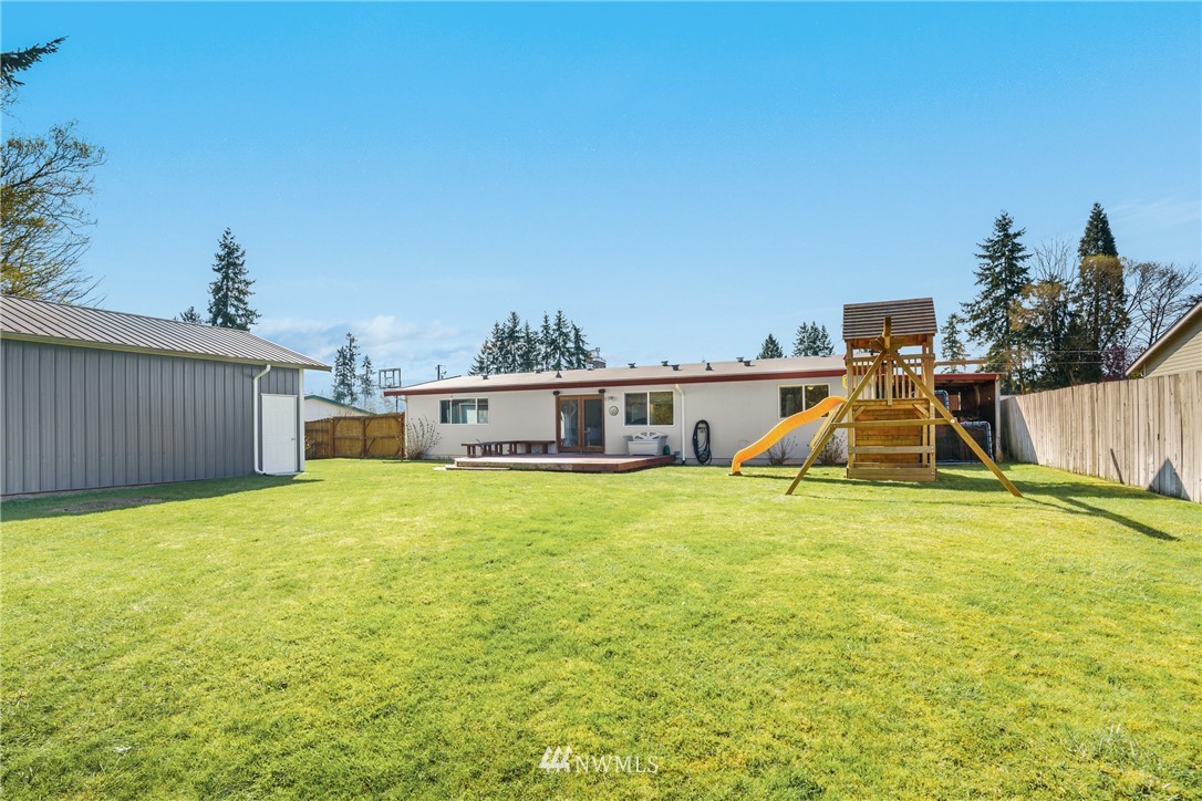4612 Northeast 23rd Street Renton, WA 98059 - Photo 23 of 24 a swimming pool with a outdoor seating and yard