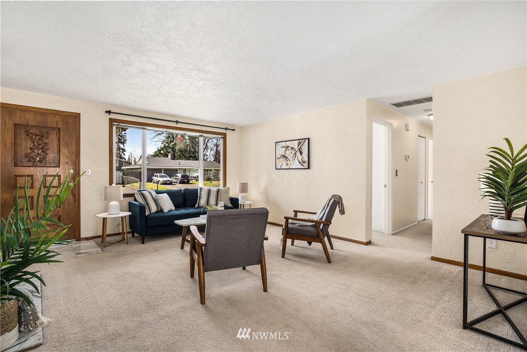4612 Northeast 23rd Street Renton, WA 98059 - Photo 9 of 24 a living room with furniture and a window
