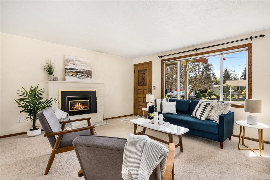 4612 Northeast 23rd Street Renton, WA 98059 - Photo 10 of 24 a living room with furniture and a large window