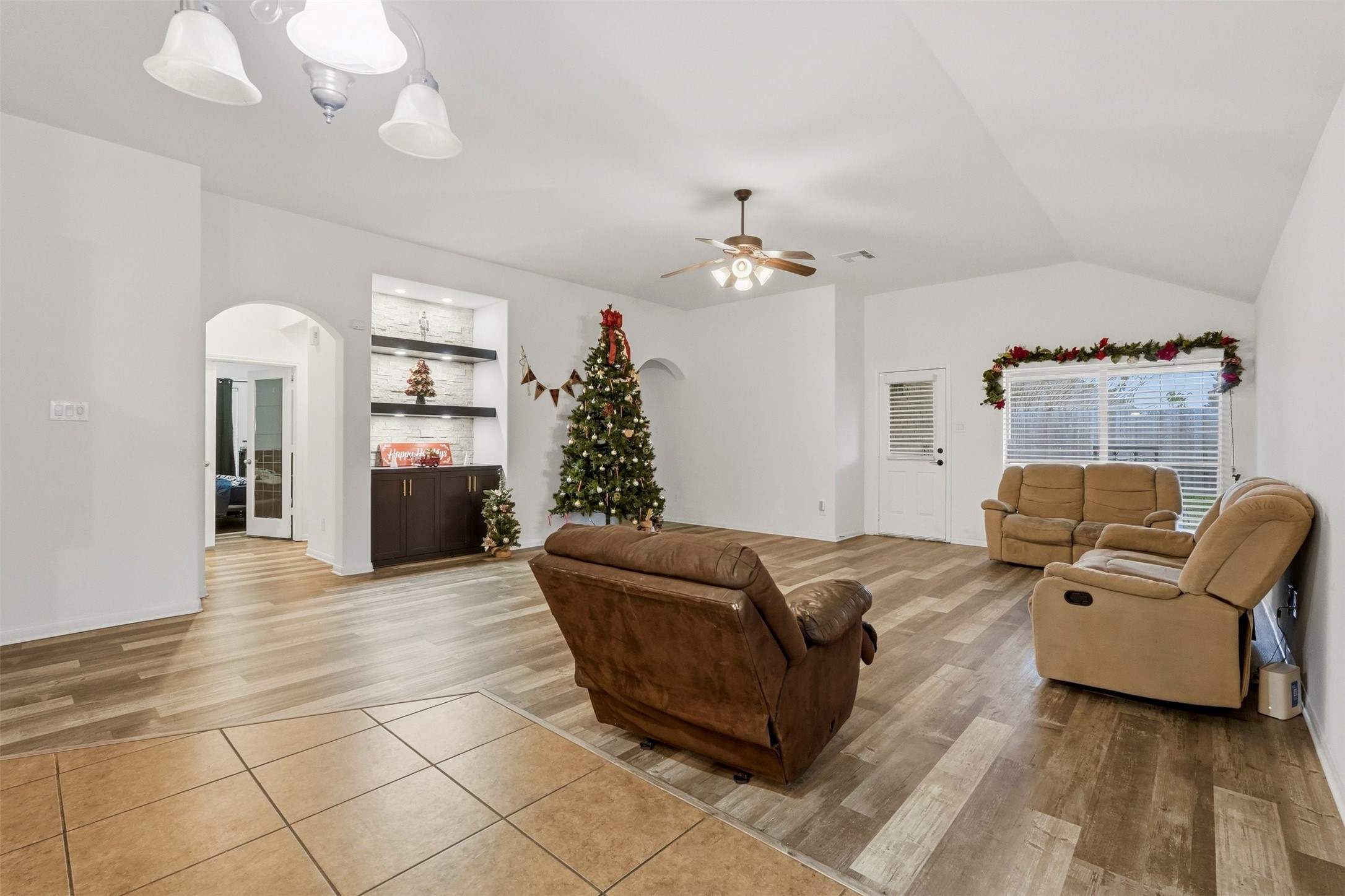 16518 Dover Mills Drive Spring, TX 77379 - Photo 13 of 28 a living room with furniture and a chandelier