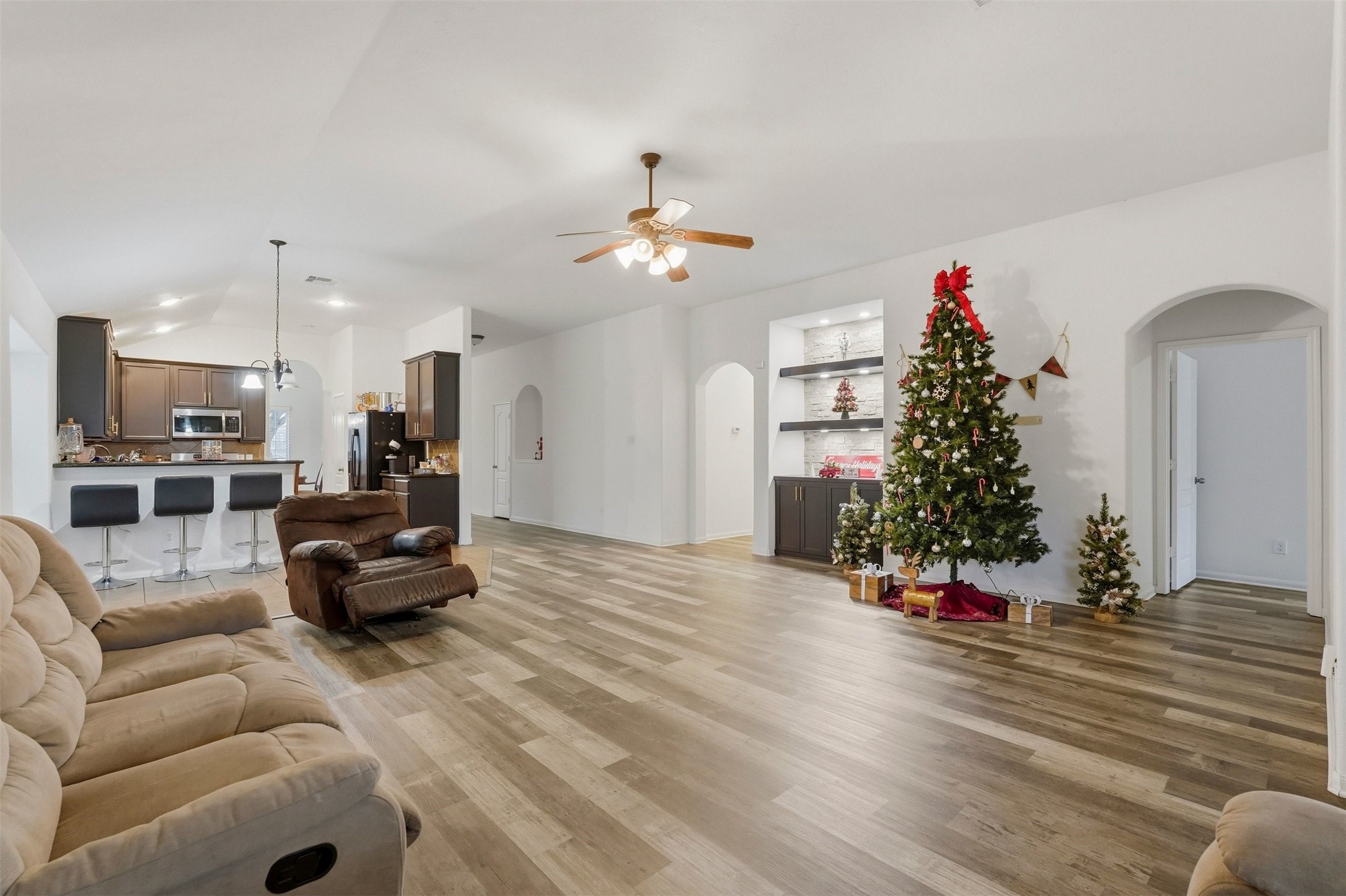 16518 Dover Mills Drive Spring, TX 77379 - Photo 15 of 28 a living room with furniture and a chandelier