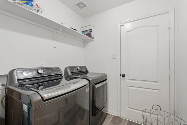 a utility room with dryer and washer