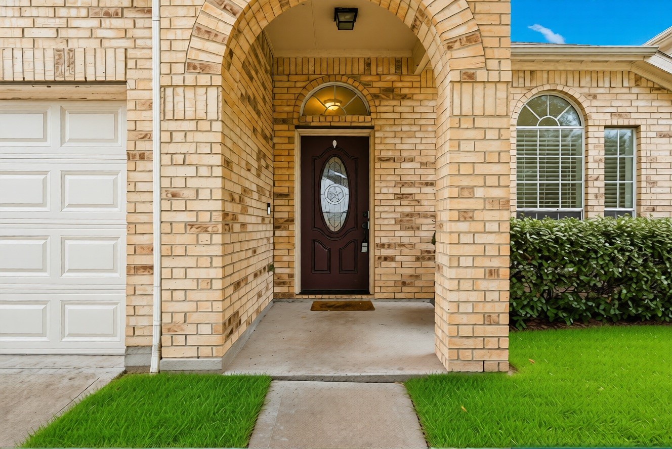 16518 Dover Mills Drive Spring, TX 77379 - Photo 3 of 28 a view of a brick house with a large windows